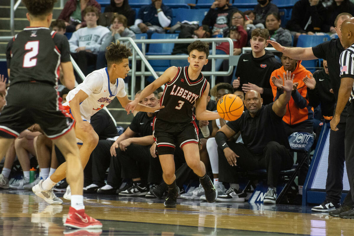 LibertyÕs Eugene Dillon passes to teammate Kristaps Kambala while being guarded by Bishop ...