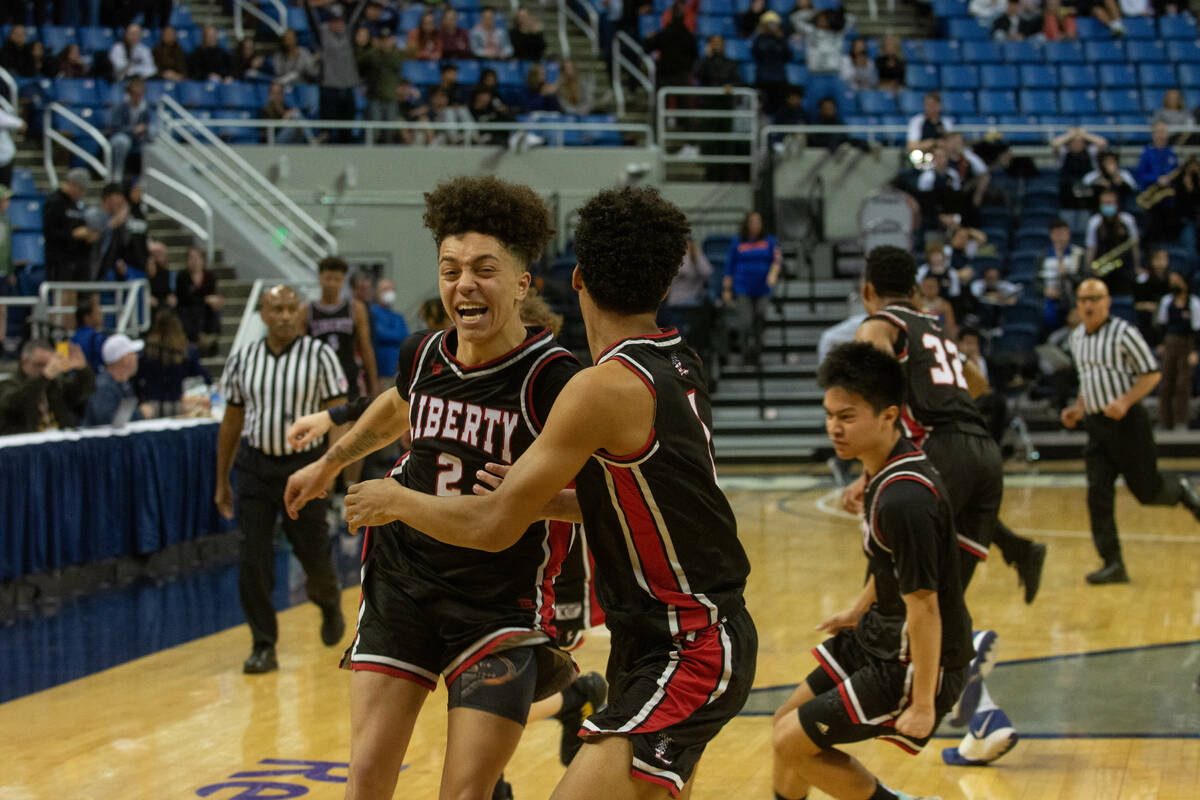 Liberty High SchoolÕs Kristaps Kambala, left, celebrates with teammates following Liberty& ...
