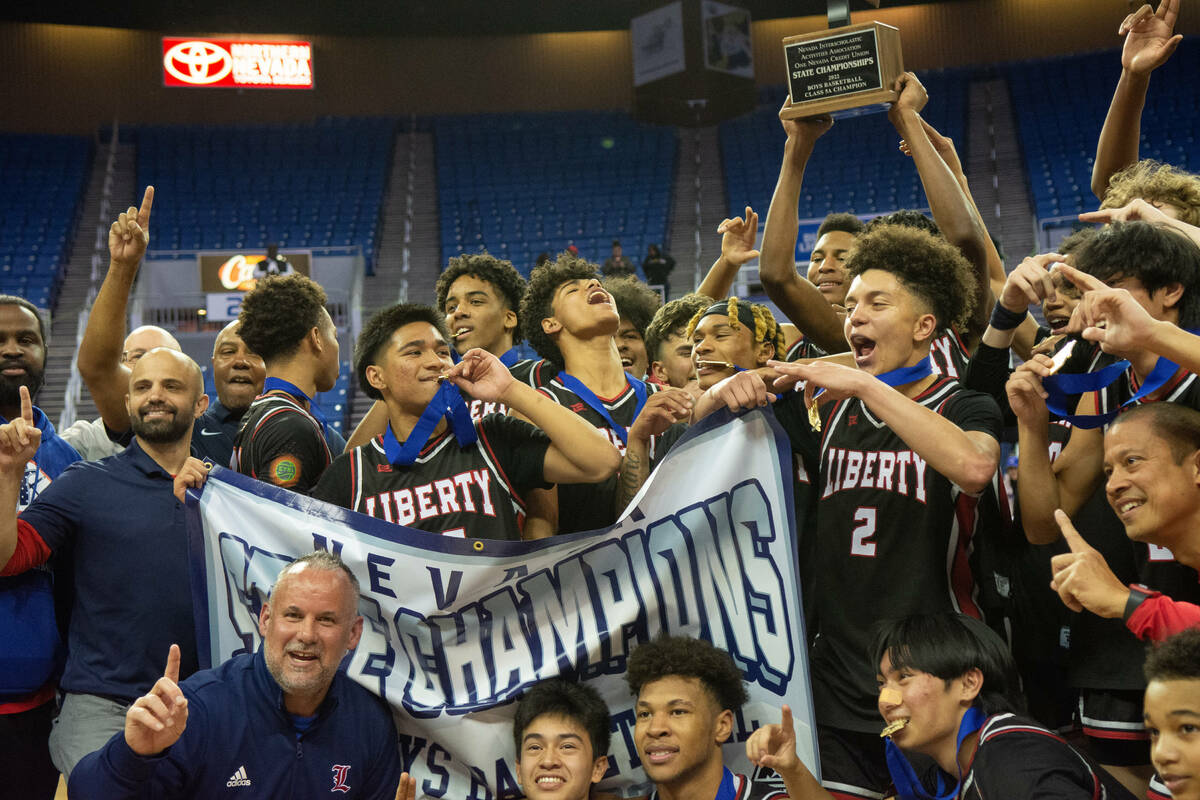Liberty High School celebrates its win over Bishop Gorman in the NIAA Class 5A boys basketball ...