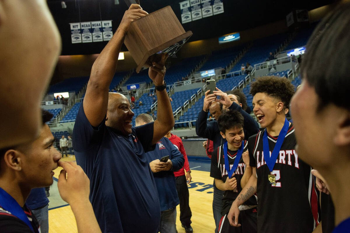 Liberty High School head coach Kevin Soares celebrates his teamÕs win over Bishop Gorman i ...