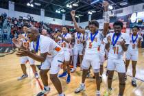 Mojave players celebrate their win over Spring Valley with a final 64-61 following the second h ...