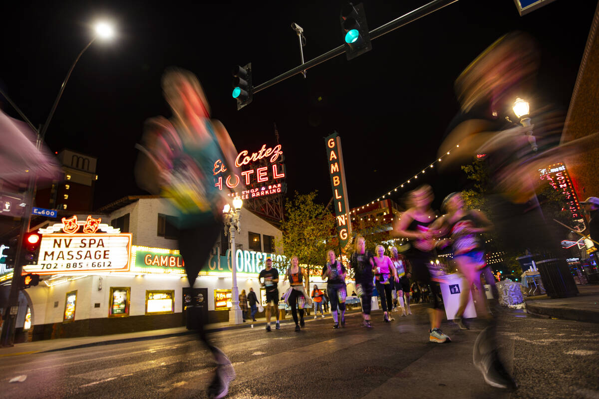 Participants run past the El Cortez during the Rock ‘n’ Roll Las Vegas half marat ...