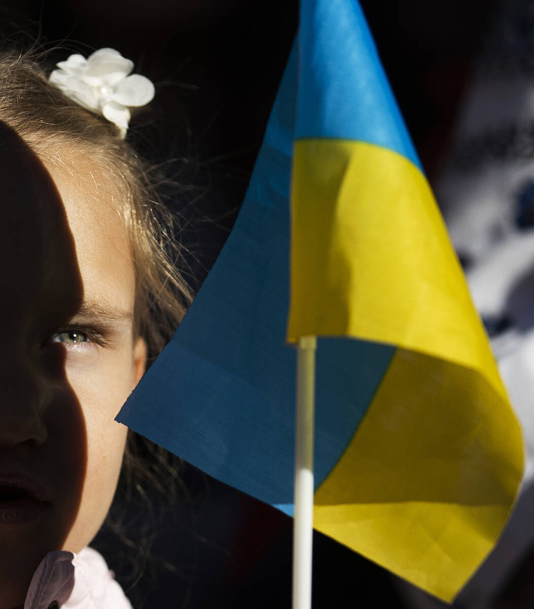 Demonstrators protest the Russian invasion of Ukraine on the Strip on Saturday, Feb. 26, 2022, ...