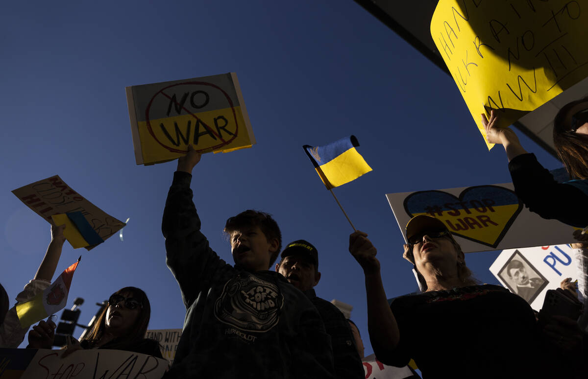 Demonstrators protest the Russian invasion of Ukraine on the Strip on Saturday, Feb. 26, 2022, ...