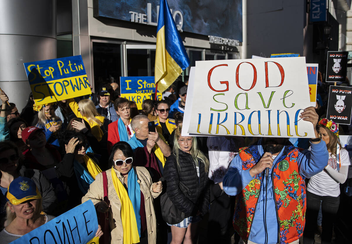 Demonstrators protest the Russian invasion of Ukraine on the Strip on Saturday, Feb. 26, 2022, ...