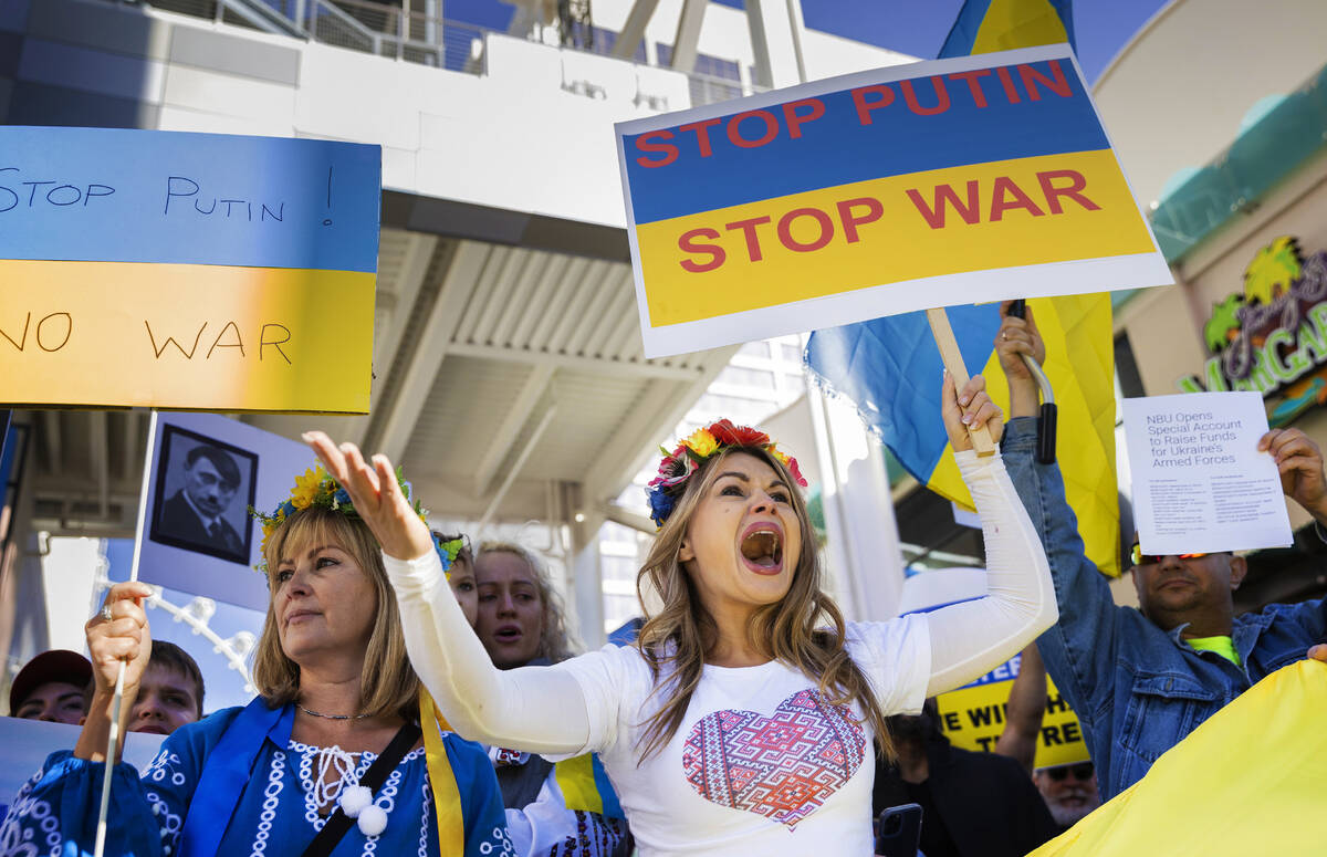 Jenny Arata, right, from Kyiv, Ukraine, leads demonstrators during a protest over the Russian i ...
