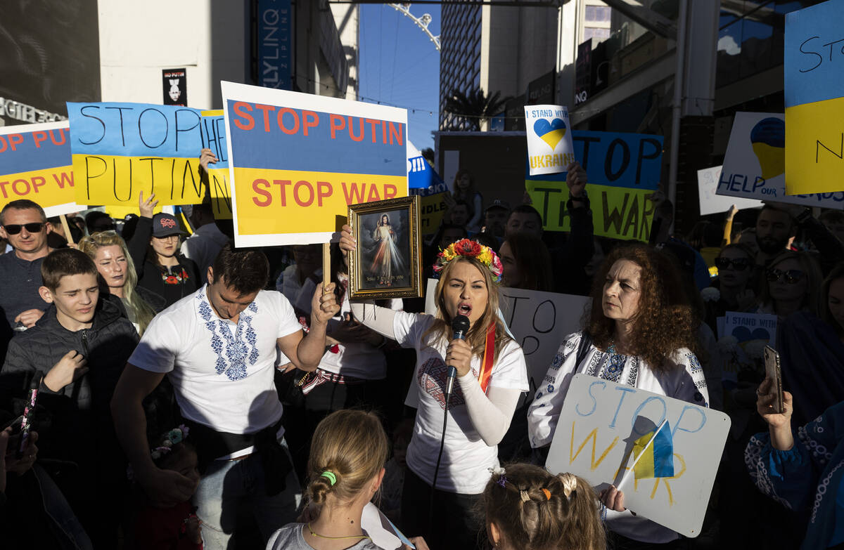 Jenny Arata, right, from Kyiv, Ukraine, leads demonstrators during a protest over the Russian i ...