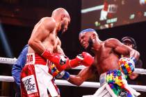 Unbeaten junior lightweight Hector Luis Garcia, left, punches Chris Colbert during his decision ...