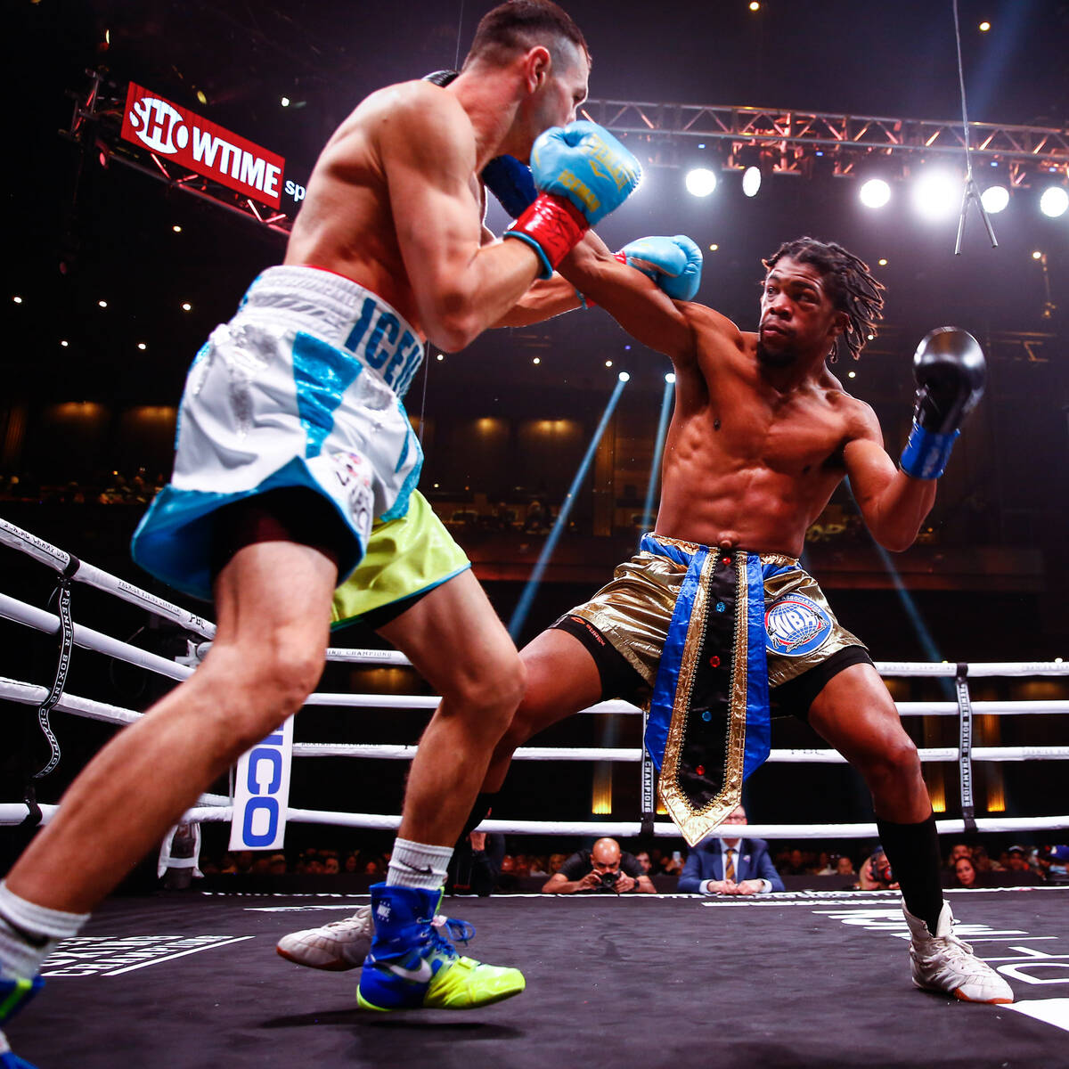 Gary Antuanne Russell punches Victor Postol during their 140-pound fight at The Chelsea inside ...