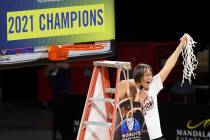 Stanford head coach Tara VanDerveer waves the net after defeating UCLA in an NCAA college baske ...