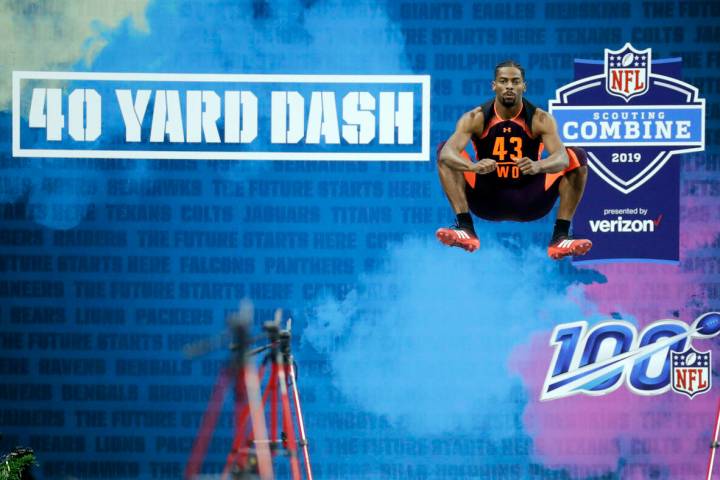 FILE - Auburn wide receiver Darius Slayton jumps before running the 40-yard dash during the NFL ...