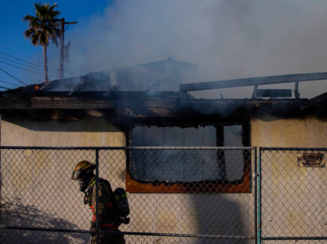 Las Vegas firefighters respond to the scene of a vacant building on fire at Maryland Parkway an ...