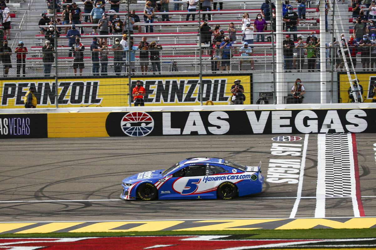 Kyle Larson crosses the start/finish line to win the NASCAR Cup Series Pennzoil 400 auto race a ...