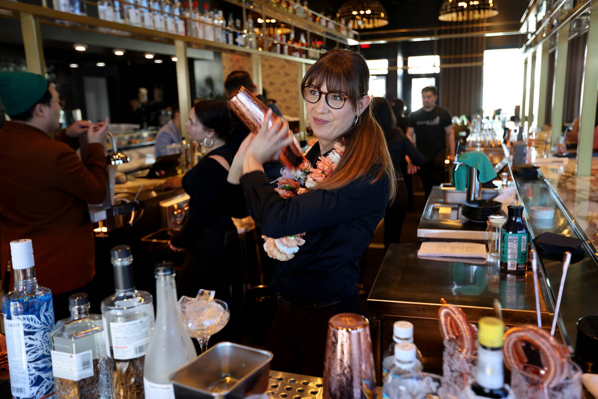 Bartender Erin Webster makes a Peach Berini at The Pepper Club at The English Hotel, named for ...
