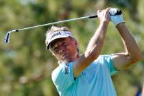 Bernhard Langer, of Germany, hits his tee shot on the eighth hole during the third round of the ...