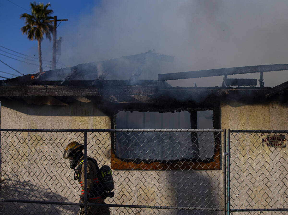 Las Vegas firefighters respond to the scene of a vacant building on fire at Maryland Parkway an ...