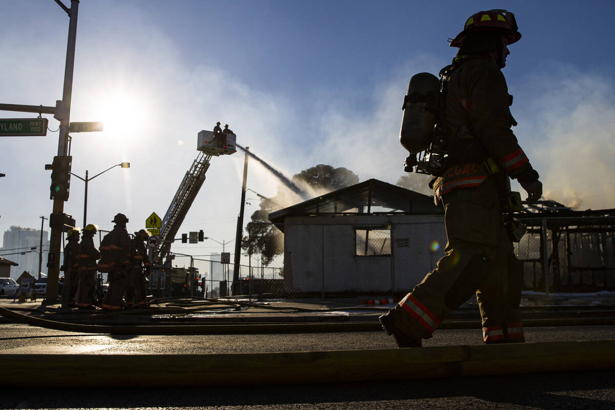 Las Vegas firefighters respond to the scene of a vacant building on fire at Maryland Parkway an ...