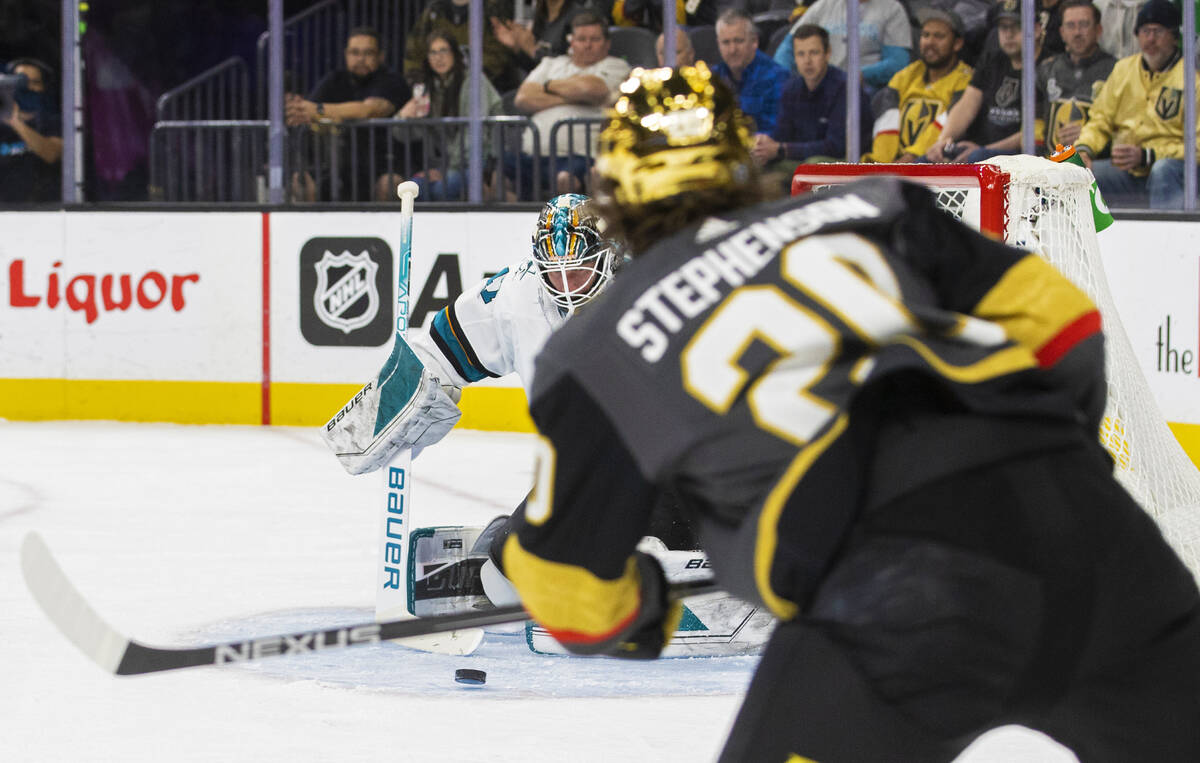 Golden Knights center Chandler Stephenson (20) shoots on San Jose Sharks goaltender James Reime ...