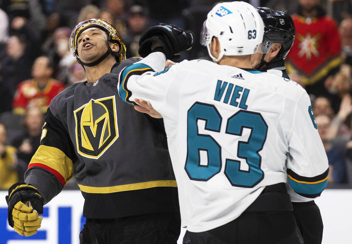 Golden Knights right wing Keegan Kolesar (55) fights San Jose Sharks left wing Jeffrey Viel (63 ...