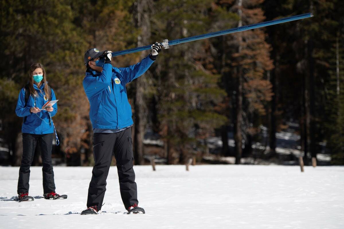 Lauren Alkire, left, and Sean de Guzman, manager of snow surveys and Water Supply Forecasting U ...