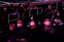 Fans wear masks inside the arena before a game between the Los Angeles Kings and the Nashville ...