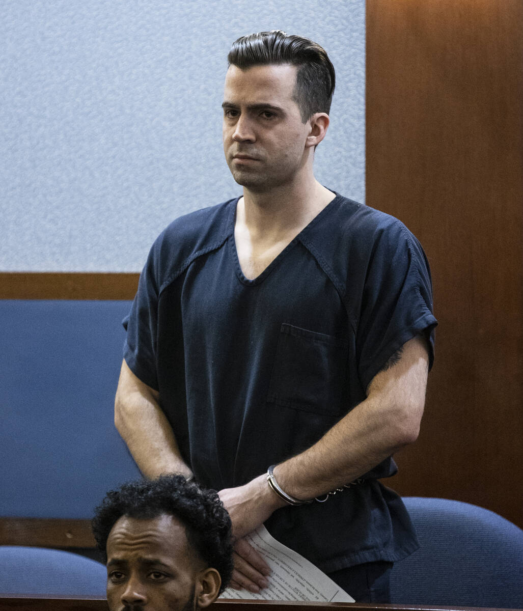 Caleb Rogers, a Las Vegas police officer who is being charged with robbing a casino, appears in ...