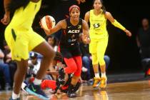 Las Vegas Aces guard Sydney Colson (51) brings the ball up court against the Seattle Storm duri ...