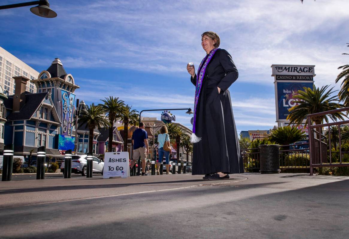 Bishop-elect Elizabeth Gardner offers ashes to passers-by for Ashes to Go on Ash Wednesday from ...