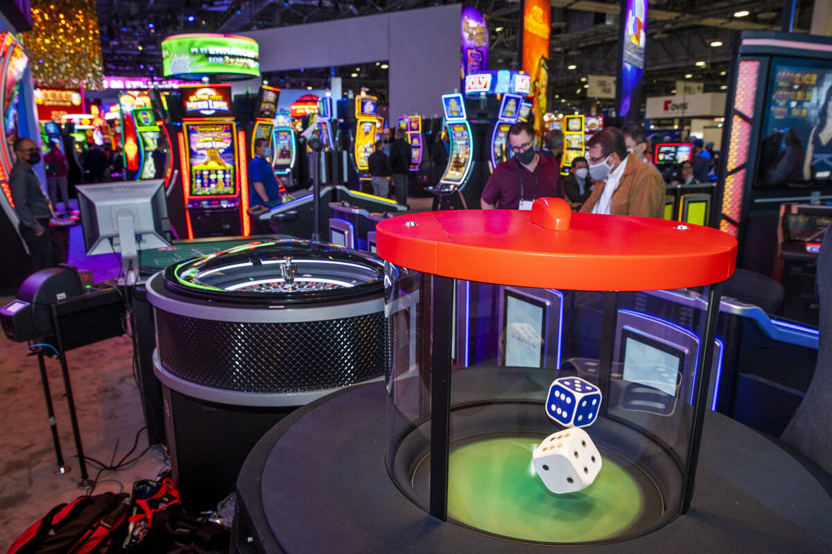 Dice hop during a roll in the new stadium seating and gaming spot about the Scientific Games Co ...