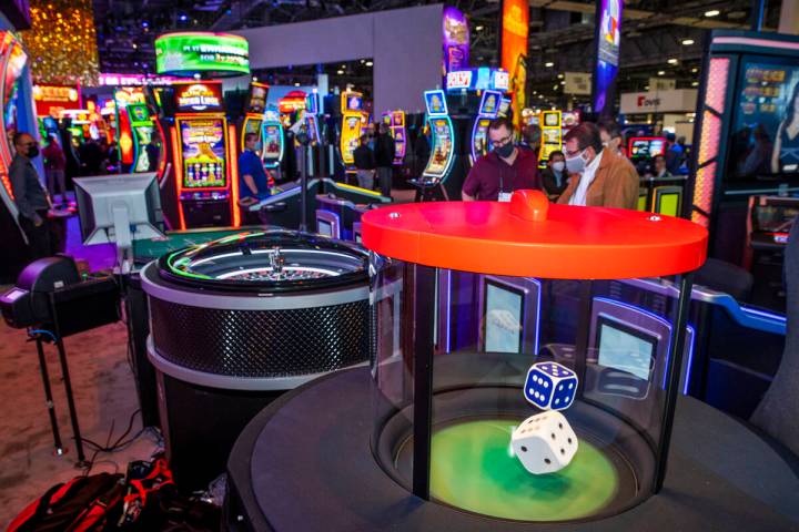 Dice hop during a roll in the new stadium seating and gaming spot about the Scientific Games Co ...