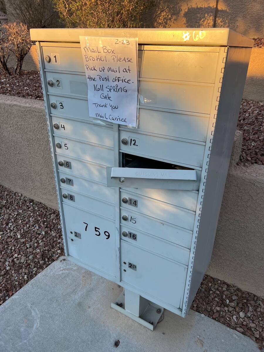 A sign, dated Feb. 23, is attached to a broken cluster mailbox on Winter Teal Avenue in Summerl ...
