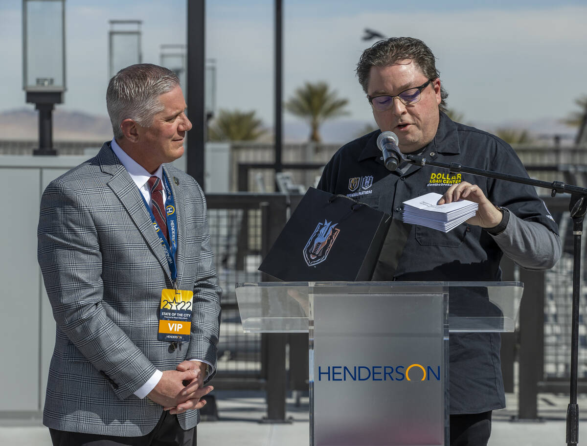 Golden Knights President and COO Kerry Bubolz looks to Dollar Loan Center owner Charles Brennan ...