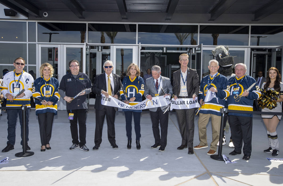 Dignitaries cut a ribbon beside with arena staff during a ceremony for the new Dollar Loan Cent ...