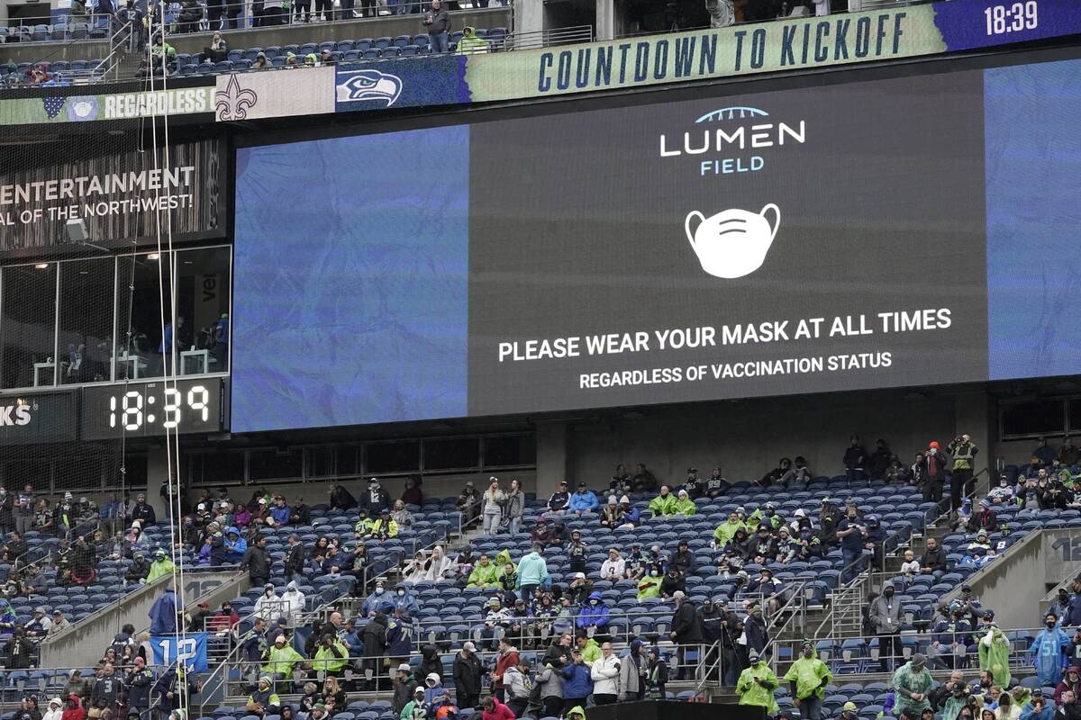 A video message reminds fans to wear masks due to the COVID-19 pandemic before an NFL football ...