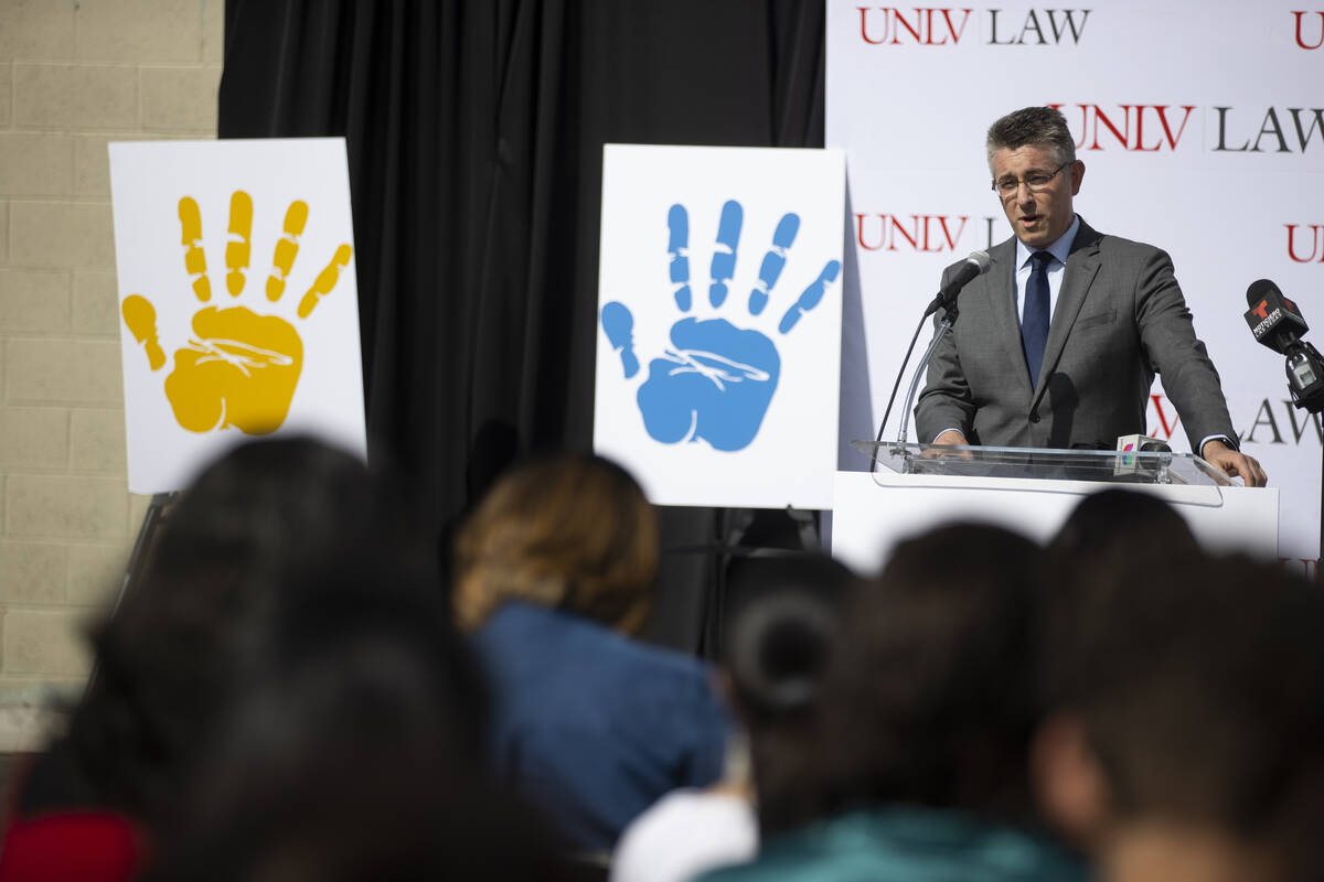Professor Michael Kagan, director of the UNLV Immigration Clinic, speaks during the grand openi ...