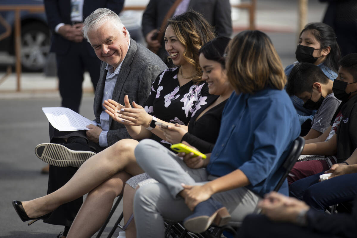 Gov. Steve Sisolak, left, participates during the grand opening ceremony for the new off-campus ...