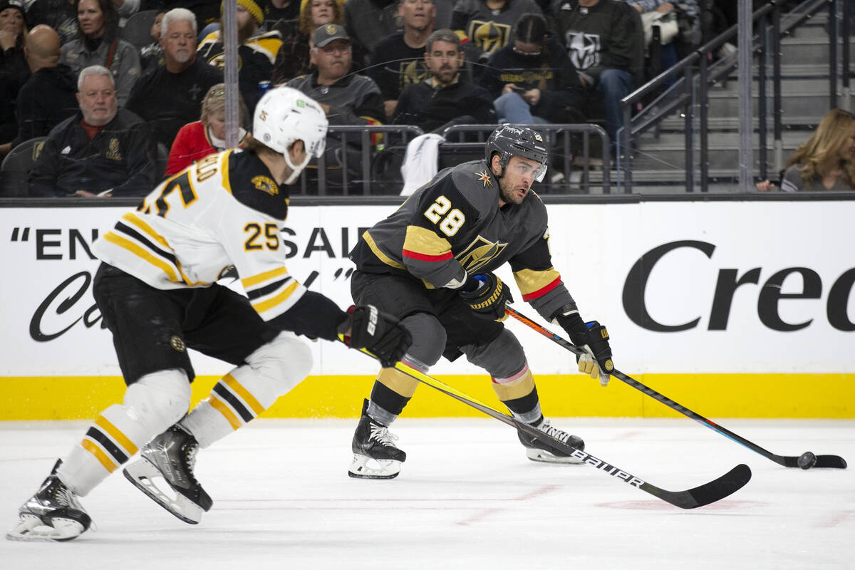 Golden Knights left wing William Carrier (28) skates for the goal against Bruins defenseman Bra ...
