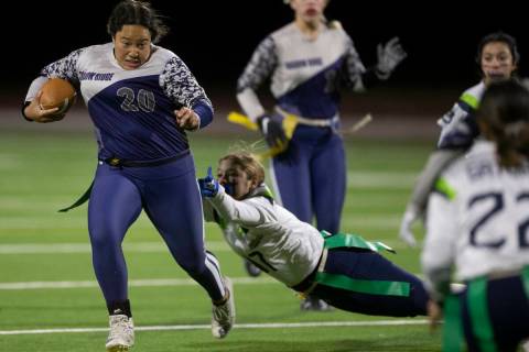 Shadow Ridge’s Mikayla Brown (20) scrambles out of the grasp of Enjoli DePhillipo (17) ...