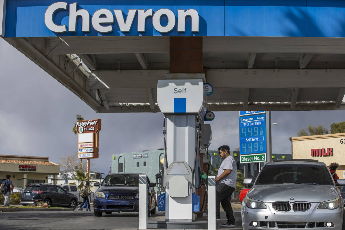 A customer pumps gas at Chevron along West Charleston Boulevard on Friday, March 4, 2022, in La ...