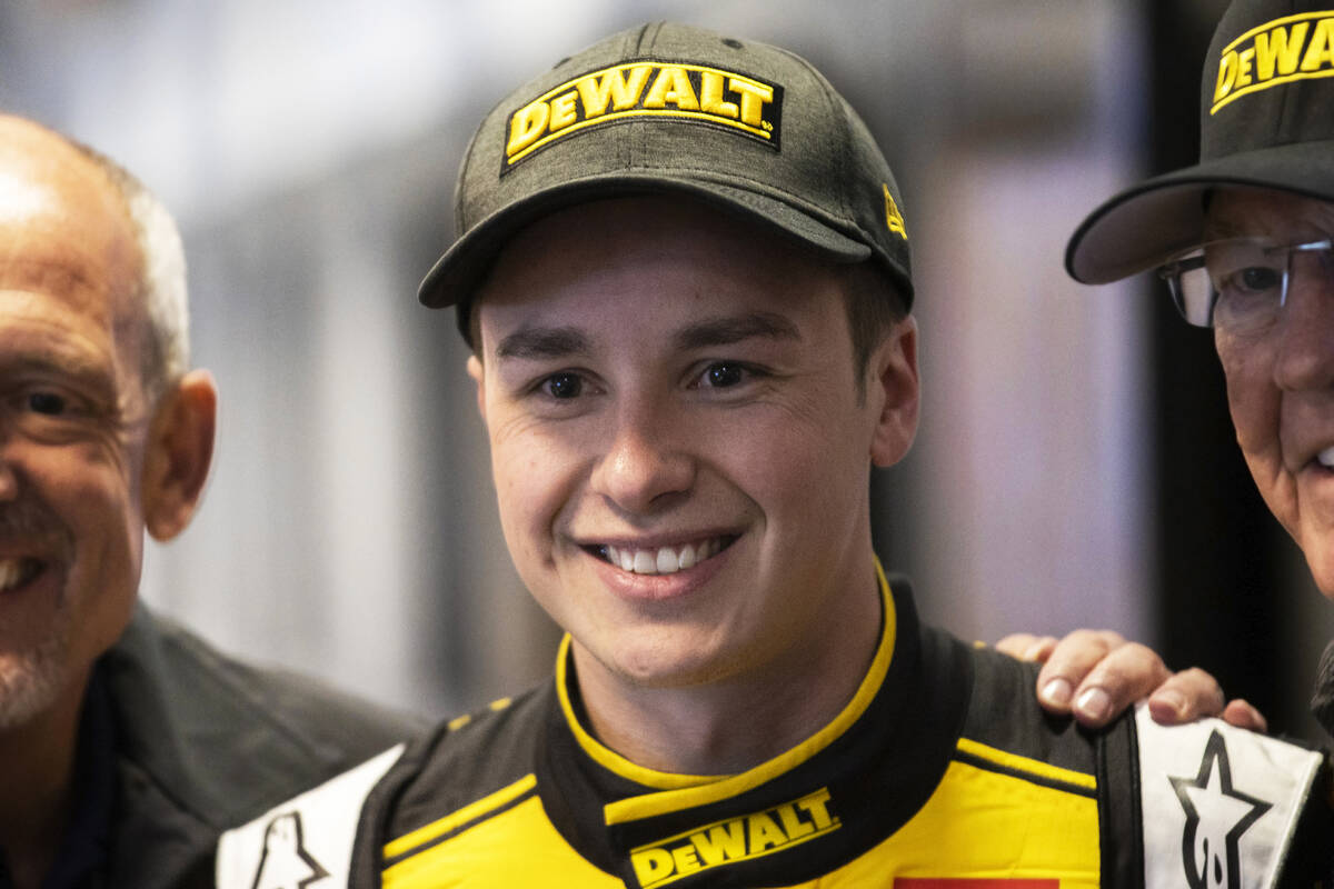 Cup Series driver Christopher Bell (20) takes photos in the media center after taking the pole ...