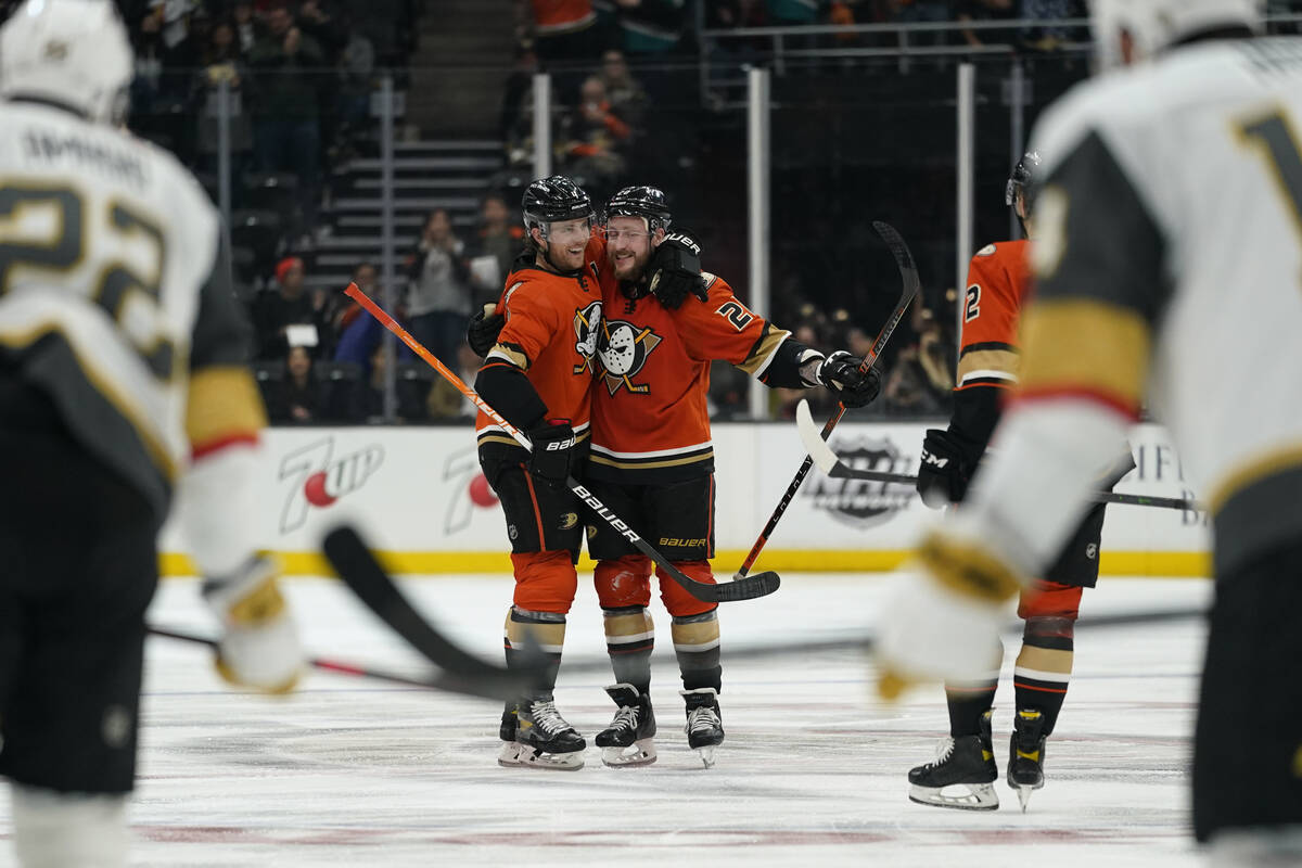 Anaheim Ducks defenseman Cam Fowler (4) hugs left wing Nicolas Deslauriers (20) after Deslaurie ...