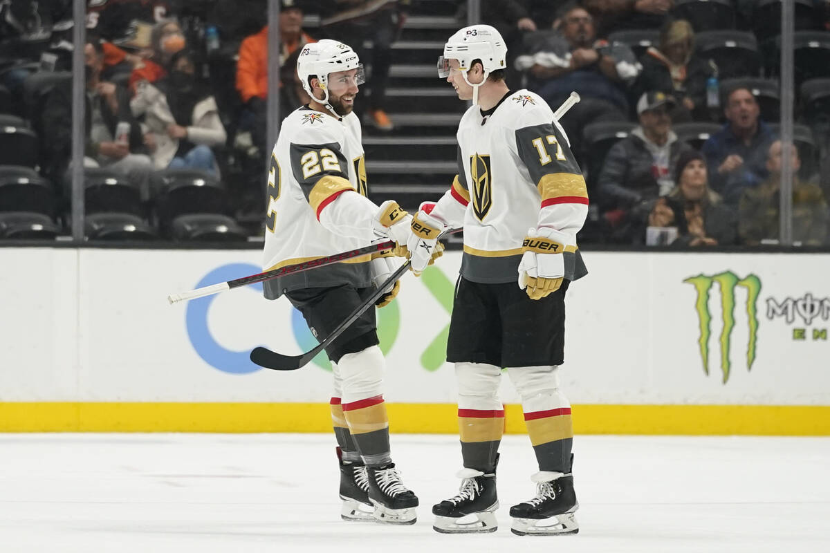 Vegas Golden Knights center Michael Amadio (22) celebrates with defenseman Ben Hutton (17) afte ...