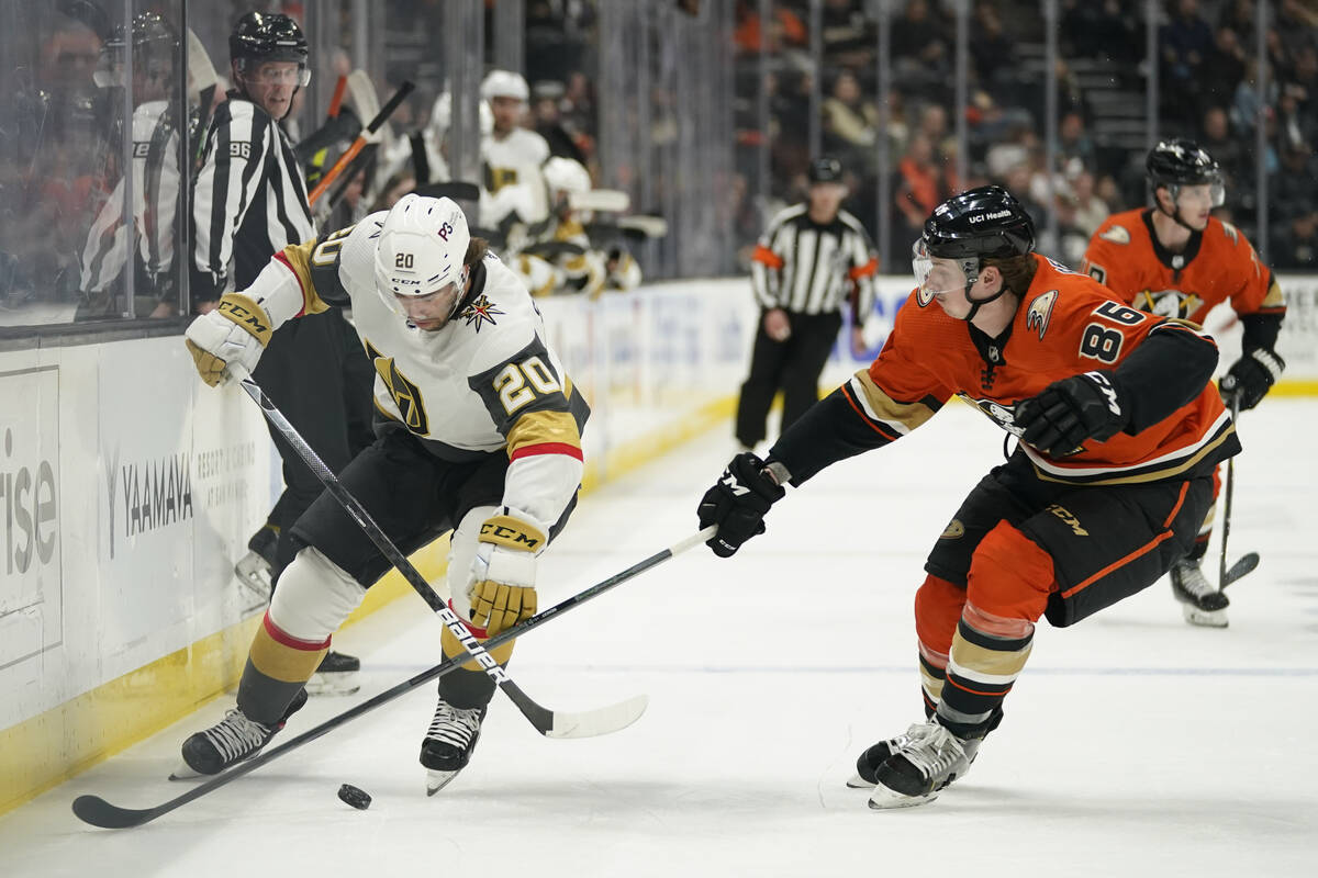 Anaheim Ducks defenseman Simon Benoit (86) defends against Vegas Golden Knights center Chandler ...