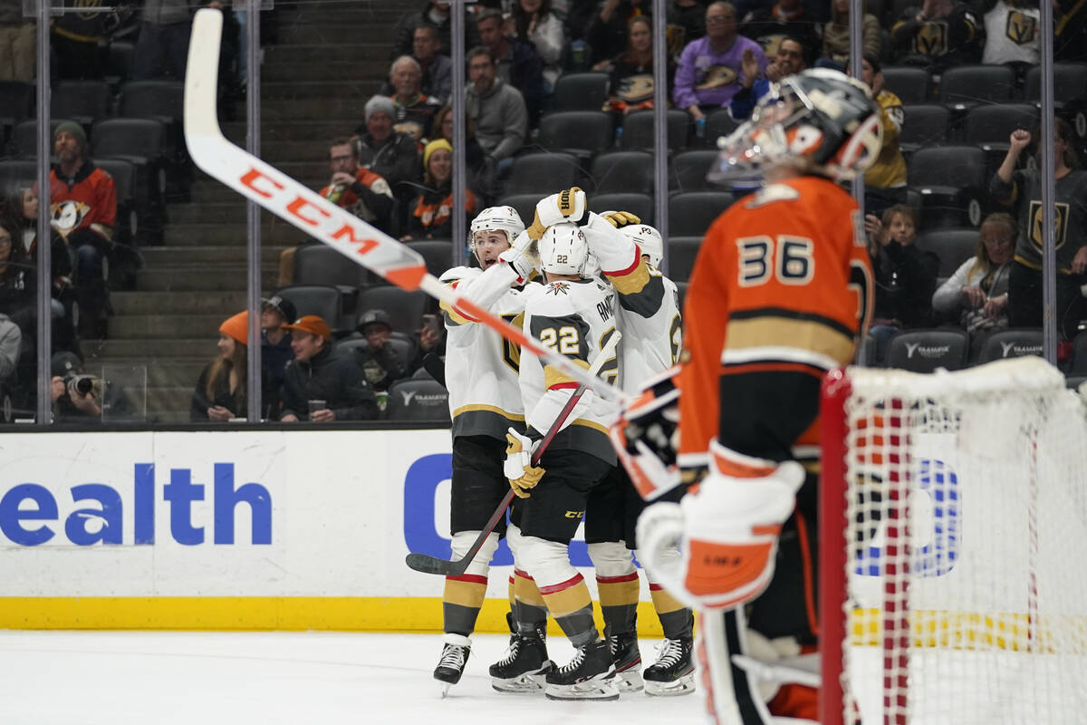 The Vegas Golden Knights celebrate after defenseman Ben Hutton (17) scored during the first per ...