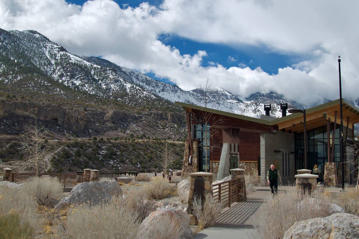 A snow cloud hovers over Mount Charleston as USDA forest fire services are at the base of the m ...