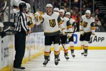 Vegas Golden Knights center Nicolas Roy (10) celebrates with teammates after scoring during the ...