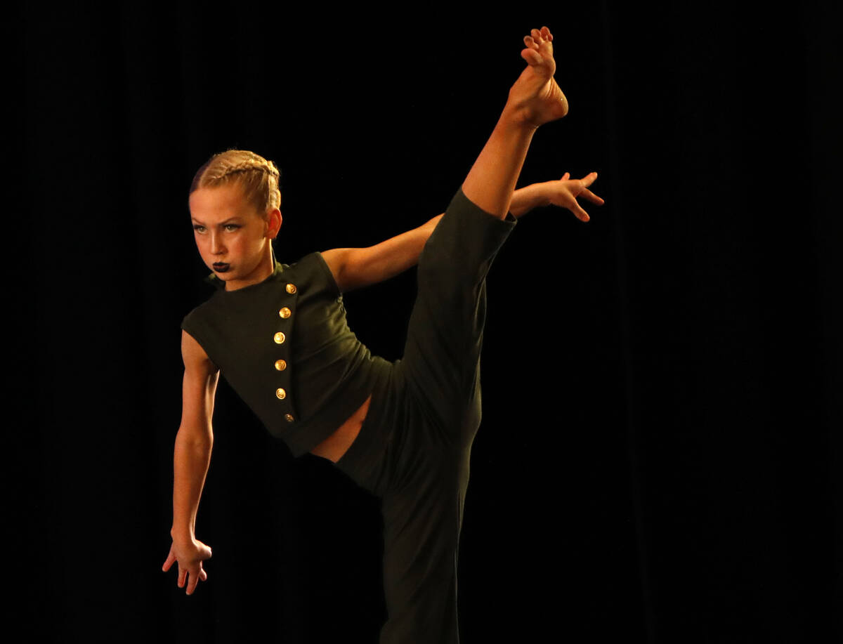 Kate Baldwin (10) competes in the Pre-Competitive Contemporary Competition Group 1 women ages 9 ...