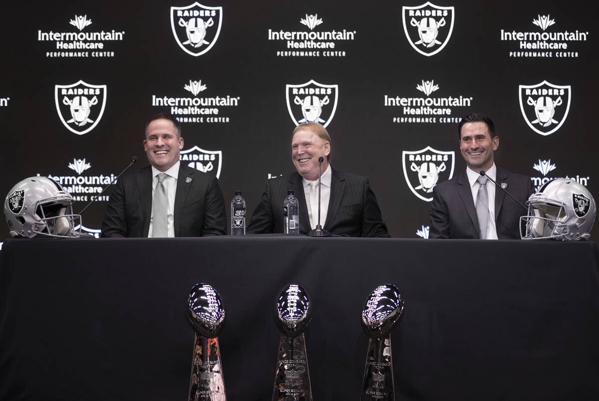 Raiders head coach Josh McDaniels, left, Raiders owner Mark Davis and Raiders general manager D ...