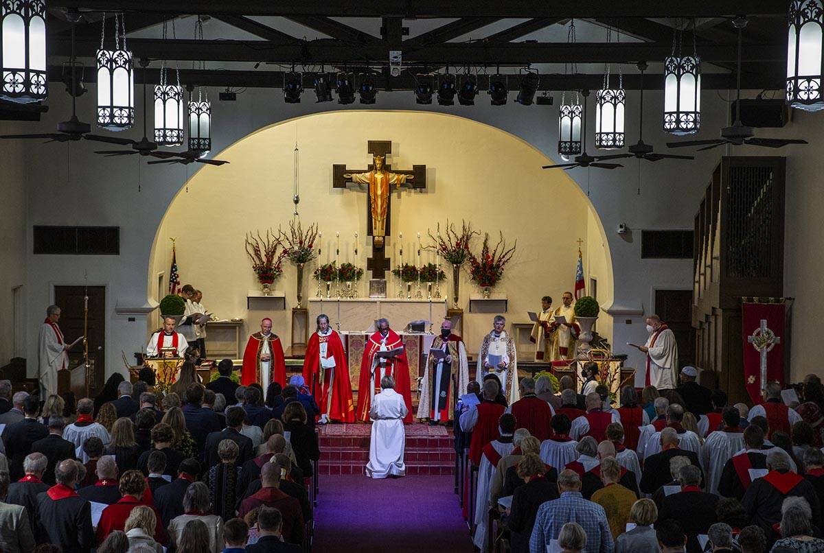 The Rev. Elizabeth Bonforte Gardner kneels at the feet of Bishops while consecrated the next Ep ...