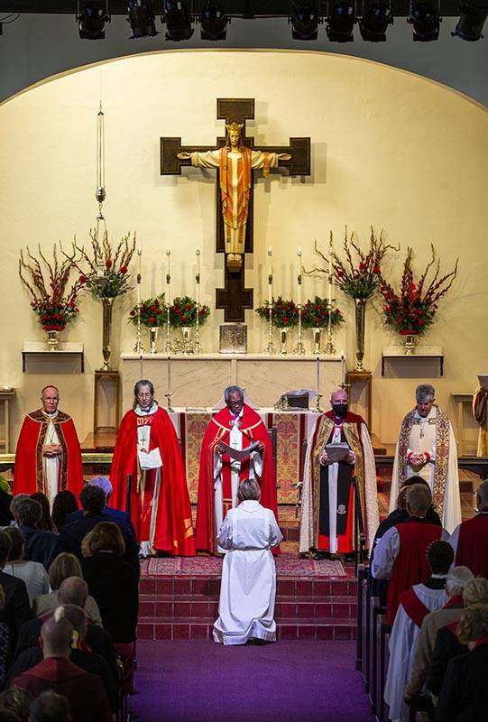 The Rev. Elizabeth Bonforte Gardner kneels at the feet of Bishops while consecrated the next Ep ...